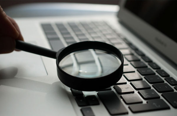 Magnifying glass on a keyboard